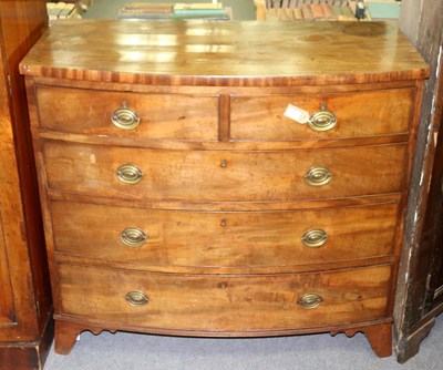 Lot 397 - A George III bowfront chest, circa 1800, of...