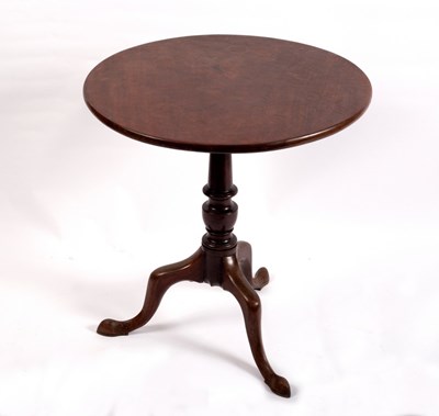 Lot 399 - A George II mahogany tilt-top circular tea...