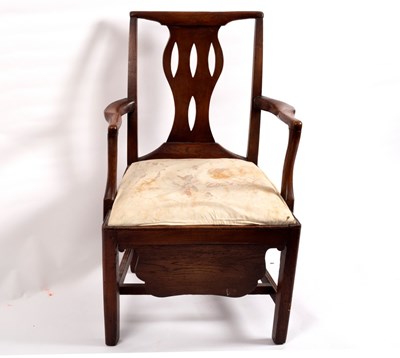 Lot 403 - A George III mahogany commode armchair, circa...