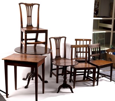 Lot 407 - Two circular oak tripod tables on turned...