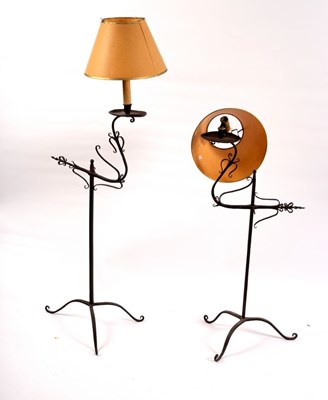 Lot 411 - Two wrought iron single light lamps on tripod...
