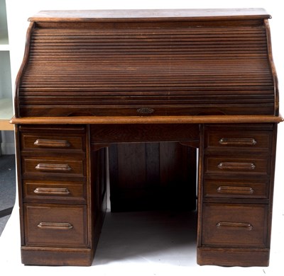 Lot 415 - An American oak rolltop desk, the tambour...
