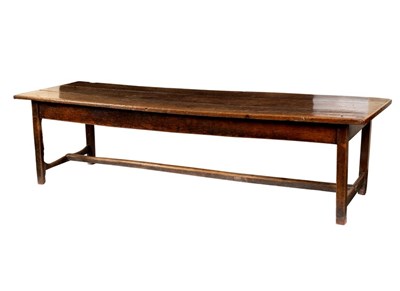 Lot 417 - An oak refectory table raised on square legs...