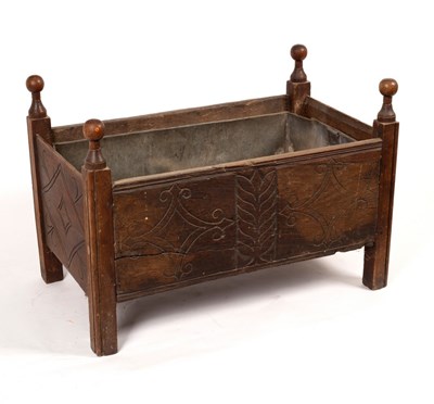 Lot 424 - A carved oak log box, part 17th Century,...