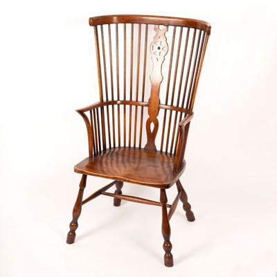 Lot 432 - A Windsor type comb back chair with elm seat...