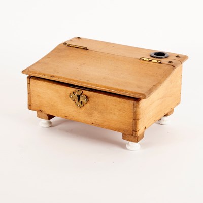 Lot 435 - A child's pine writing slope on ceramic feet,...