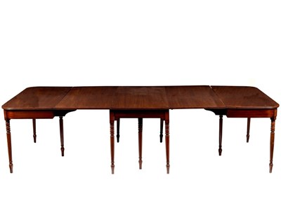Lot 445 - A Regency mahogany dining table on turned...