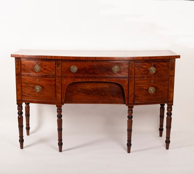 Lot 447 - A George III mahogany bowfront sideboard on...