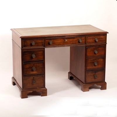 Lot 454 - A mahogany pedestal desk, the green leather...