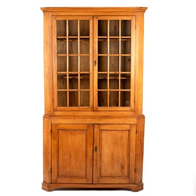 Lot 458 - A pine corner cupboard with glazed upper...