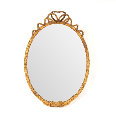 Lot 468 - An oval gilt framed mirror with ribbon-tie to...