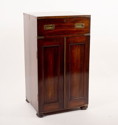 Lot 469 - A campaign chest fitted a drawer over cupboard...