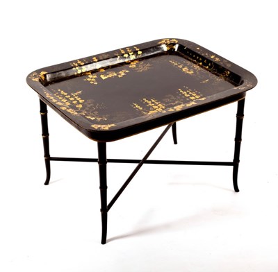 Lot 474 - A black lacquered papier-mâché tray on faux...