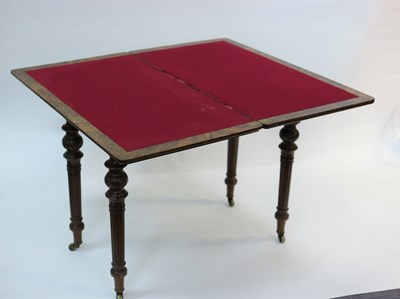 Lot 485 - A Victorian figured walnut card table, the...