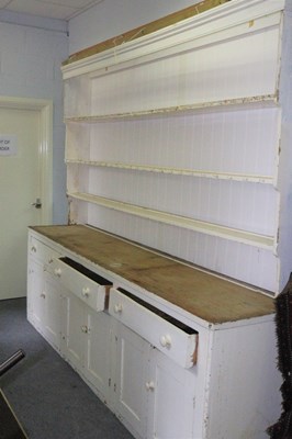 Lot 487 - A large white painted pine dresser base,...