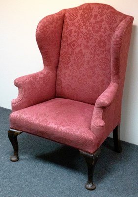 Lot 497 - An 18th Century style wing armchair, on...