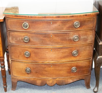 Lot 516 - A 19th Century mahogany bowfront chest of four...