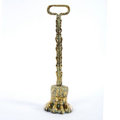 Lot 922 - A brass hair claw door porter with ring handle,...