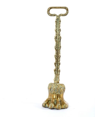 Lot 923 - A brass hair claw door porter with ring handle,...