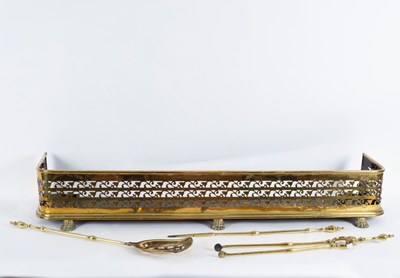 Lot 925 - Three brass fire irons and an early pierced...