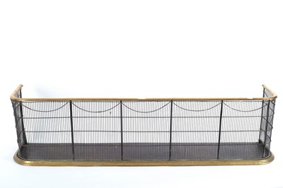 Lot 928 - A Victorian brass and wire fender, circa 1840,...
