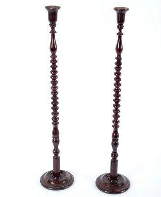 Lot 929 - A pair of beech candlesticks with bobbin...