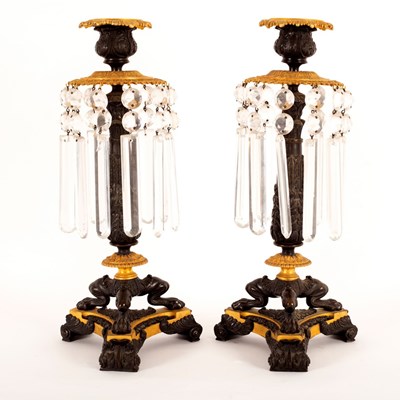 Lot 941 - A pair of Empire lustre candlesticks on three...