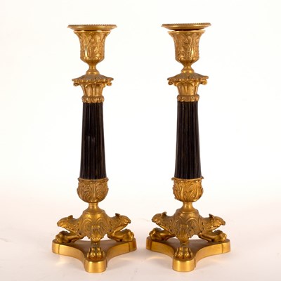 Lot 943 - A pair of Empire candlesticks, 28cm high