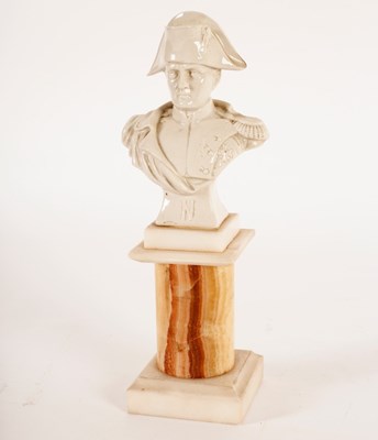 Lot 983 - A ceramic bust of Napoleon, on agate plinth,...