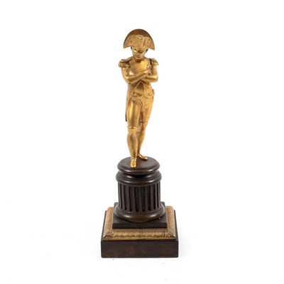 Lot 996 - A gilt bronze figure of Napoleon on a fluted...