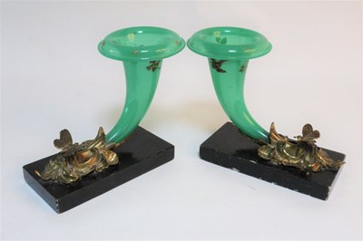 Lot 1013 - A pair of green glass cornucopia shaped vases...