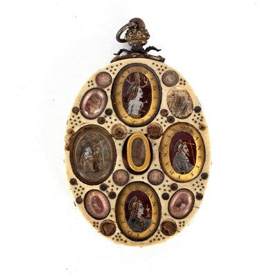 Lot 1015 - An oval reliquary ivory pendant, Italian or...