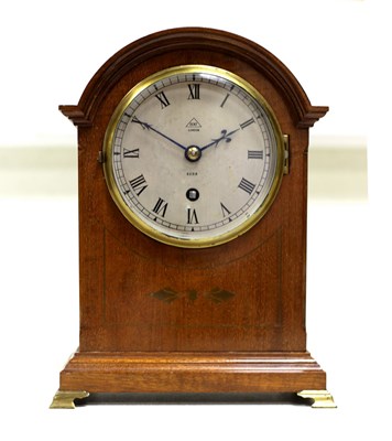 Lot 1041 - A mahogany arched mantel clock, circa 1920,...