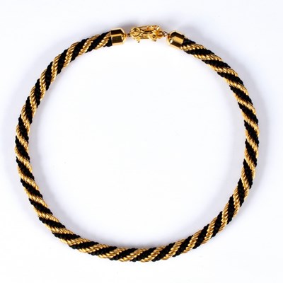 Lot 5 - Celine, a black and gold twisted rope style...
