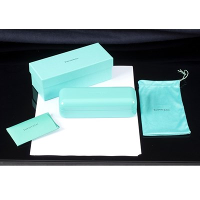 Lot 8 - Tiffany & Co., a glasses case with guarantee...