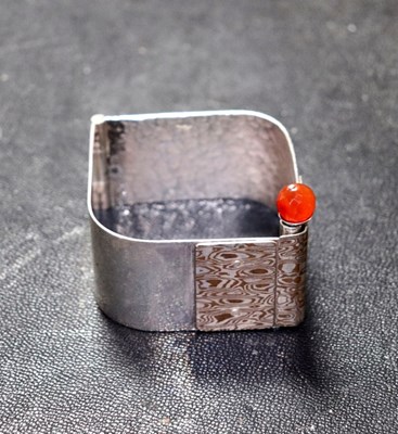 Lot 14 - An Italian silver bangle, of modernist design...