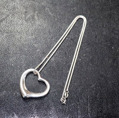Lot 15 - Elsa Peretti for Tiffany, a silver open heart...