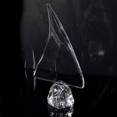 Lot 48 - Daum, France, a clear glass sculpture of sail...