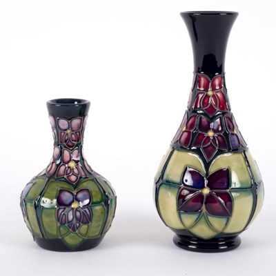 Lot 71 - Moorcroft Pottery, two Violet pattern vases,...