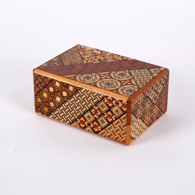Lot 260 - A Japanese twenty step puzzle box, decorated...