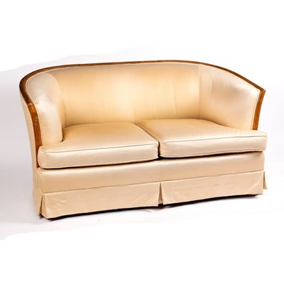 Lot 317 - An Art Deco style sofa, with curved wood frame...