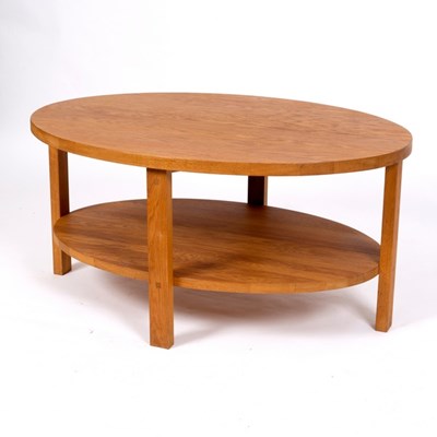 Lot 329 - A Laura Ashley modern oak oval coffee table,...