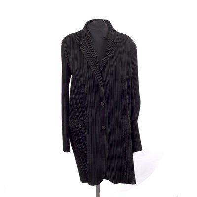 Lot 643 - An Issey Miyake black long-line fitted jacket,...