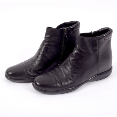 Lot 653 - A pair of Prada black leather ankle boots,...