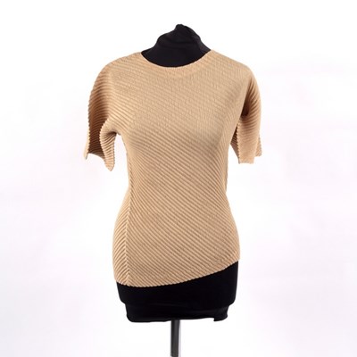Lot 656 - An Issey Miyake short sleeved champagne...