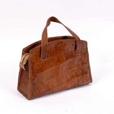 Lot 659 - A crocodile skin handbag