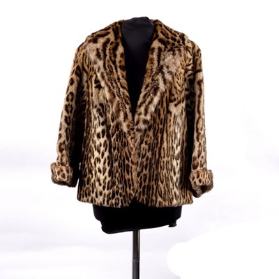 Lot 660 - An ocelot fur jacket, with fold back cuffs and...
