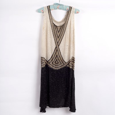 Lot 661 - A 1920s evening dress decorated Art Deco...