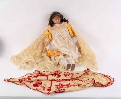 Lot 665 - A Victorian wax doll with glass eyes, wax arms...