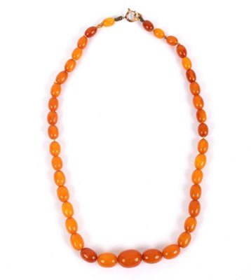 Lot 162 - A Baltic amber necklace of graduated oval...